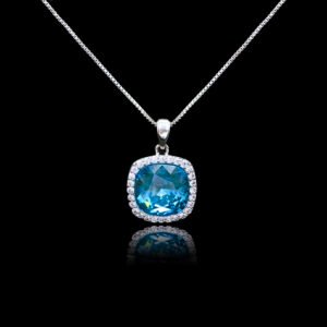 Wholesale cushion crystal necklace with a deep blue Swarovski Elements stone and halo pendant on platinum plated copper from JuneJewelry.com.