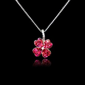 Wholesale clover crystal necklace with four bright blue Swarovski Elements heart stones on platinum plated copper from JuneJewelry.com.