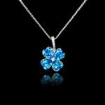 Wholesale clover crystal necklace with four bright blue Swarovski Elements heart stones on platinum plated copper from JuneJewelry.com.