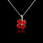 Wholesale clover crystal necklace with four bright blue Swarovski Elements heart stones on platinum plated copper from JuneJewelry.com.