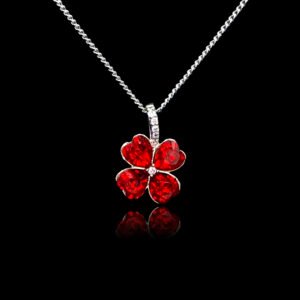 Wholesale clover crystal necklace with four bright blue Swarovski Elements heart stones on platinum plated copper from JuneJewelry.com.