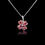 Wholesale clover crystal necklace with four bright blue Swarovski Elements heart stones on platinum plated copper from JuneJewelry.com.