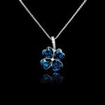 Wholesale clover crystal necklace with four bright blue Swarovski Elements heart stones on platinum plated copper from JuneJewelry.com.