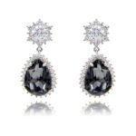Wholesale statement crystal earrings with a pink pear-shaped Swarovski element stone and platinum plated copper from JuneJewelry.com – bulk bridal jewelry.