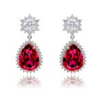 Wholesale statement crystal earrings with a pink pear-shaped Swarovski element stone and platinum plated copper from JuneJewelry.com – bulk bridal jewelry.