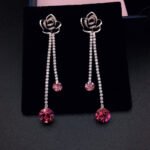Wholesale rose crystal earrings with blue Swarovski Elements crystals on platinum plated brass by JuneJewelry.com – unique tassel earrings for bulk order.