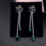 Wholesale rose crystal earrings with blue Swarovski Elements crystals on platinum plated brass by JuneJewelry.com – unique tassel earrings for bulk order.