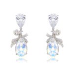 Wholesale crystal bow earrings with clear teardrop Swarovski element stones and platinum plated copper from JuneJewelry.com – bulk bridal ribbon jewelry.