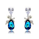 Wholesale crystal bow earrings with clear teardrop Swarovski element stones and platinum plated copper from JuneJewelry.com – bulk bridal ribbon jewelry.