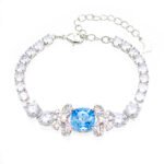 Wholesale blue crystal bracelet with square Swarovski Elements crystal and butterfly accents on platinum plated brass by JuneJewelry.com – luxury bulk jewelry.
