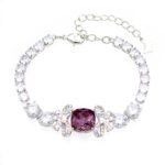 Wholesale blue crystal bracelet with square Swarovski Elements crystal and butterfly accents on platinum plated brass by JuneJewelry.com – luxury bulk jewelry.