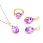 Wholesale crystal jewelry set including purple oval stone necklace, ring, and earrings on rose gold plated zinc alloy from JuneJewelry.com.