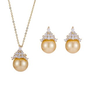 High-end light luxury crown pearl jewelry set wholesale featuring a delicate micro-pave zircon tiara cap pendant necklace and matching pearl stud earrings on junejewelry.com