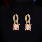 Elegant geometric square crystal jewelry wholesale set featuring micro-pave rhinestone huggie hoop earrings and matching pendant necklace from junejewelry.com