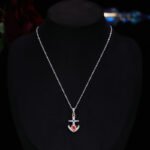 Niche Western style anchor cross jewelry set wholesale showing a brilliant micro-pave crystal ship anchor pendant necklace and matching stud earrings from junejewelry.com