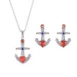 Niche Western style anchor cross jewelry set wholesale showing a brilliant micro-pave crystal ship anchor pendant necklace and matching stud earrings from junejewelry.com