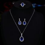 Premium luxury teardrop zircon jewelry set wholesale featuring a solitaire pear-cut pendant necklace, drop earrings, and halo ring on junejewelry.com