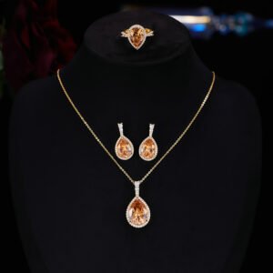 Premium luxury teardrop zircon jewelry set wholesale featuring a solitaire pear-cut pendant necklace, drop earrings, and halo ring on junejewelry.com