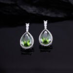 Premium luxury teardrop zircon jewelry set wholesale featuring a solitaire pear-cut pendant necklace, drop earrings, and halo ring on junejewelry.com