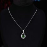 Premium luxury teardrop zircon jewelry set wholesale featuring a solitaire pear-cut pendant necklace, drop earrings, and halo ring on junejewelry.com