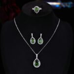 Premium luxury teardrop zircon jewelry set wholesale featuring a solitaire pear-cut pendant necklace, drop earrings, and halo ring on junejewelry.com