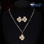 Elegant vintage French style camellia zircon jewelry set wholesale featuring a multi-layered micro-pave crystal flower pendant on an asymmetric pearl chain and matching flower stud earrings on junejewelry.com