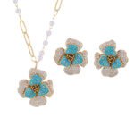 Elegant vintage French style camellia zircon jewelry set wholesale featuring a multi-layered micro-pave crystal flower pendant on an asymmetric pearl chain and matching flower stud earrings on junejewelry.com