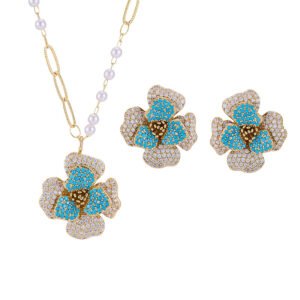 Elegant vintage French style camellia zircon jewelry set wholesale featuring a multi-layered micro-pave crystal flower pendant on an asymmetric pearl chain and matching flower stud earrings on junejewelry.com
