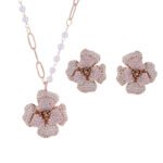 Elegant vintage French style camellia zircon jewelry set wholesale featuring a multi-layered micro-pave crystal flower pendant on an asymmetric pearl chain and matching flower stud earrings on junejewelry.com