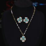Elegant vintage French style camellia zircon jewelry set wholesale featuring a multi-layered micro-pave crystal flower pendant on an asymmetric pearl chain and matching flower stud earrings on junejewelry.com
