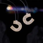 Sparkly horseshoe U shape jewelry set wholesale featuring micro zircon pendant necklace and stud earrings in 18K gold plating from junejewelry.com