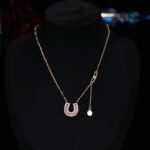 Sparkly horseshoe U shape jewelry set wholesale featuring micro zircon pendant necklace and stud earrings in 18K gold plating from junejewelry.com