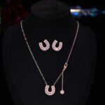 Sparkly horseshoe U shape jewelry set wholesale featuring micro zircon pendant necklace and stud earrings in 18K gold plating from junejewelry.com