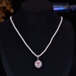 High-end oval zircon pearl jewelry set wholesale featuring a royal crystal cluster pendant on a classic pearl strand and matching statement stud earrings from junejewelry.com