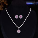 High-end oval zircon pearl jewelry set wholesale featuring a royal crystal cluster pendant on a classic pearl strand and matching statement stud earrings from junejewelry.com