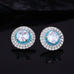 High-end round halo zircon jewelry set wholesale featuring a brilliant solitaire crystal pendant necklace and matching round stud earrings from junejewelry.com