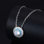 High-end round halo zircon jewelry set wholesale featuring a brilliant solitaire crystal pendant necklace and matching round stud earrings from junejewelry.com