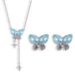 Niche summer blue crystal butterfly jewelry set wholesale featuring an aquamarine pear-cut gemstone butterfly pendant with dangling star chain tassels and matching butterfly stud earrings from junejewelry.com