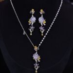 Retro wedding style light luxury vintage flower zircon jewelry set wholesale featuring an asymmetric half-link half-pearl chain cascading floral drop necklace and matching long drop earrings from junejewelry.com