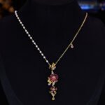 Retro wedding style light luxury vintage flower zircon jewelry set wholesale featuring an asymmetric half-link half-pearl chain cascading floral drop necklace and matching long drop earrings from junejewelry.com