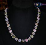 Western style heavy-craft luxury flower zircon jewelry set wholesale featuring an interlocking marquise and oval cut colorful crystal floral collar necklace with matching linear drop earrings from junejewelry.com