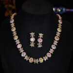 Western style heavy-craft luxury flower zircon jewelry set wholesale featuring an interlocking marquise and oval cut colorful crystal floral collar necklace with matching linear drop earrings from junejewelry.com