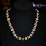 Western style heavy-craft luxury flower zircon jewelry set wholesale featuring an interlocking marquise and oval cut colorful crystal floral collar necklace with matching linear drop earrings from junejewelry.com