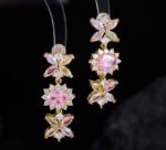 Western style heavy-craft luxury flower zircon jewelry set wholesale featuring an interlocking marquise and oval cut colorful crystal floral collar necklace with matching linear drop earrings from junejewelry.com