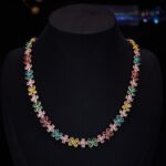 Western style light luxury flower zircon jewelry set wholesale featuring a colorful crystal floral tennis choker necklace and matching triple-tier flower pearl drop earrings from junejewelry.com
