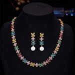 Western style light luxury flower zircon jewelry set wholesale featuring a colorful crystal floral tennis choker necklace and matching triple-tier flower pearl drop earrings from junejewelry.com