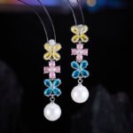 Western style light luxury flower zircon jewelry set wholesale featuring a colorful crystal floral tennis choker necklace and matching triple-tier flower pearl drop earrings from junejewelry.com