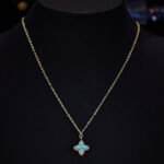 Niche high-end turquoise four leaf clover jewelry set wholesale featuring marquise-cut turquoise resin petals framed by brilliant micro-pave crystals from junejewelry.com