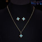 Niche high-end turquoise four leaf clover jewelry set wholesale featuring marquise-cut turquoise resin petals framed by brilliant micro-pave crystals from junejewelry.com