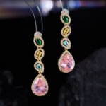 High-end cross-border heavy-craft colorful gemstone jewelry set wholesale featuring a cascading V-shaped multi-colored crystal necklace with a pink teardrop drop and matching long drop earrings from junejewelry.com